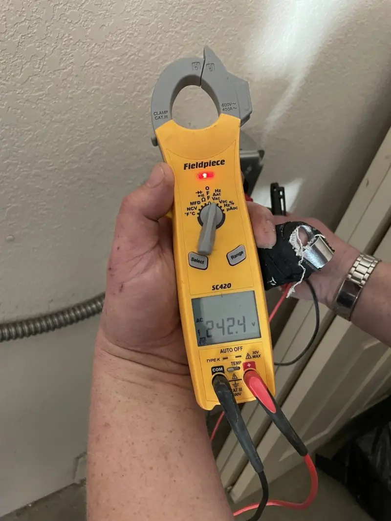 Voltage testing with clamp meter during Generator Installation in Garden Home-Whitford